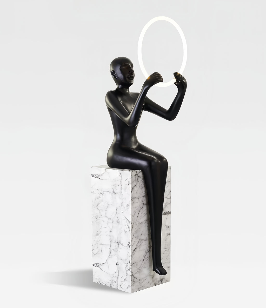 Hand held circular abstract sitting posture statue floor lamp